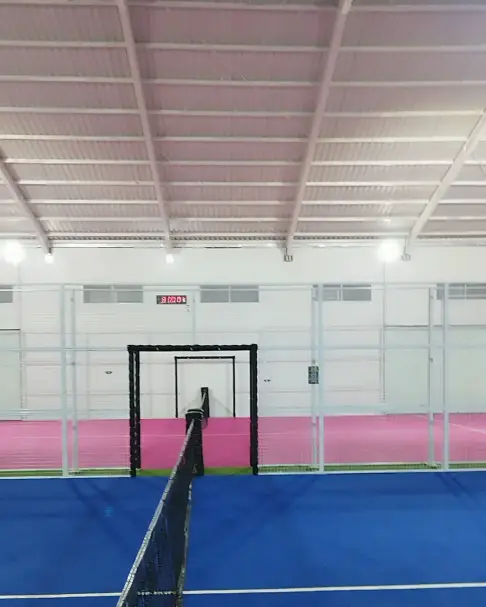 Looking down the net toward the pink-trimmed court