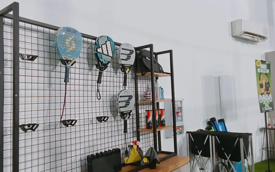 Rackets hanging on a grid wall